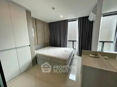 Modern bedroom with sleek design and ample natural light