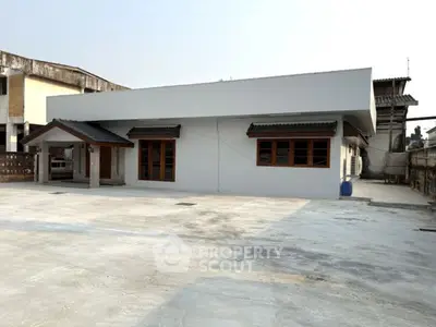Spacious single-story house with ample parking space and modern design.