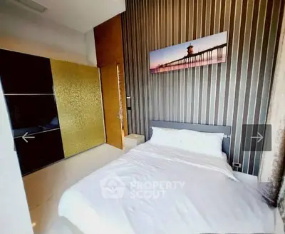 Modern bedroom with stylish decor and large wardrobe in a contemporary apartment.