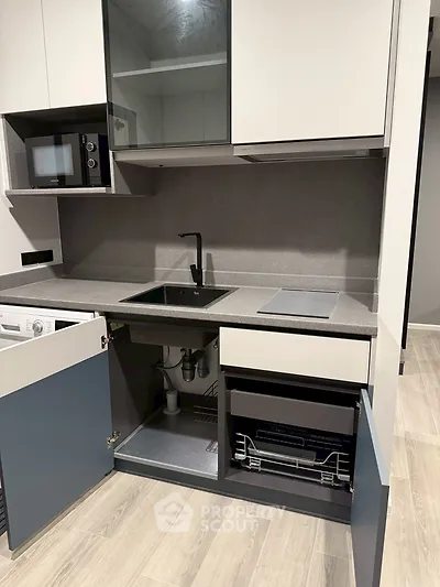 Modern kitchen with sleek cabinetry and built-in appliances