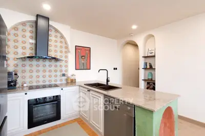 Charming kitchen with modern appliances and stylish backsplash in a cozy home setting.
