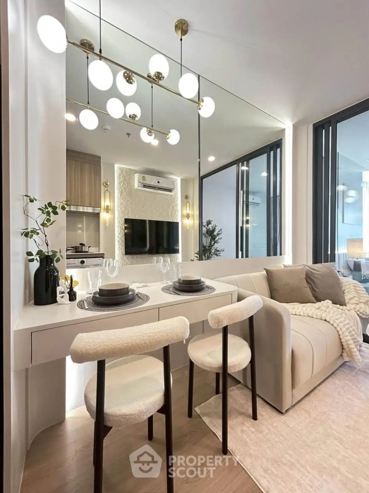 Modern living room with elegant dining area and stylish lighting in a contemporary apartment.