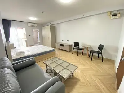 Spacious modern studio apartment with stylish furniture and natural light