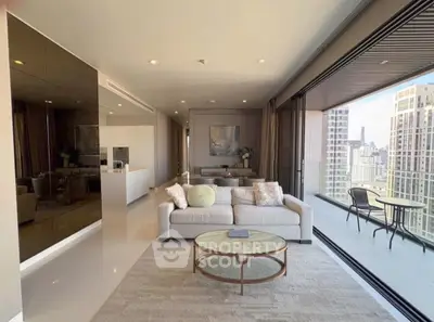 Luxurious living room with stunning city view and spacious balcony