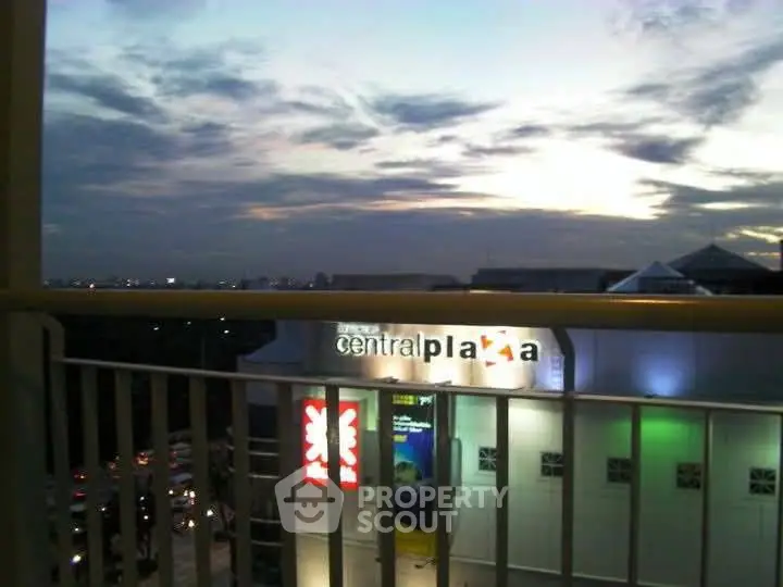 Stunning cityscape view from a balcony overlooking Central Plaza at sunset.