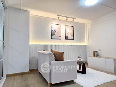 Modern living room with cozy white sofa and stylish decor