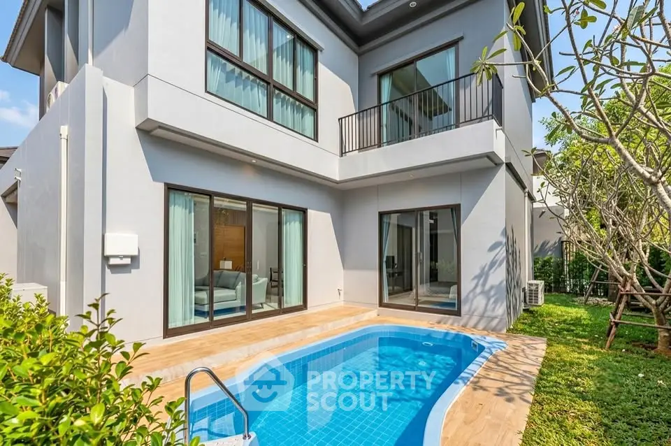 Modern two-story house with private pool and lush garden