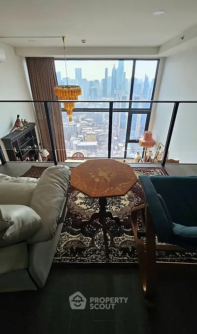 Luxurious living room with stunning city skyline view, elegant decor, and floor-to-ceiling windows.