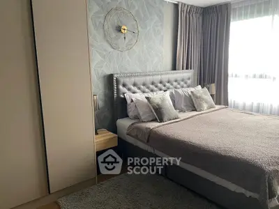 Luxurious bedroom with plush bedding and elegant decor, featuring a stylish headboard and soft lighting.