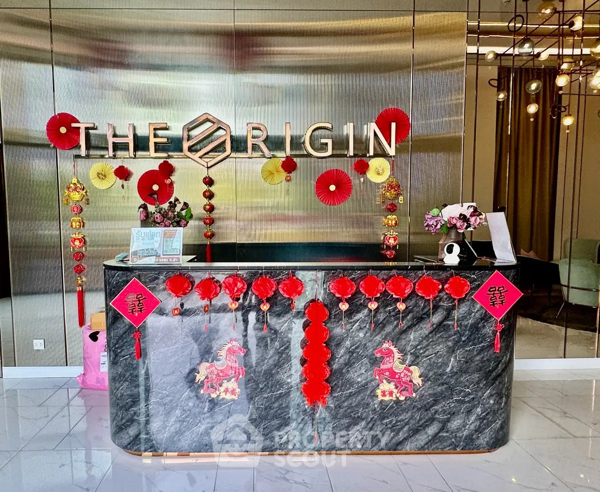 Elegant real estate lobby with festive decorations and modern design elements.