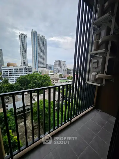 Modern balcony with city skyline view, perfect for urban living enthusiasts.