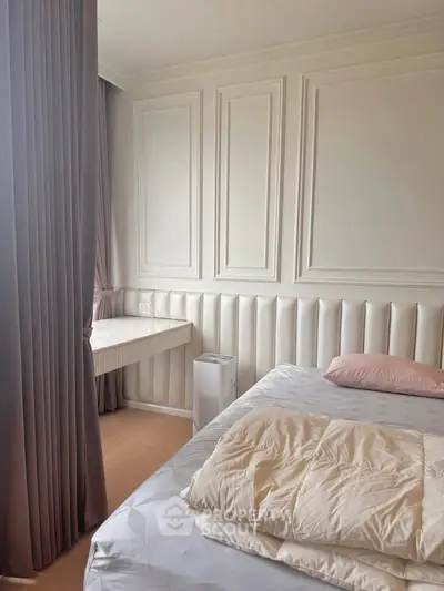 Elegant bedroom with luxurious paneling and cozy bedding