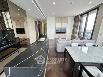 Luxurious modern living room with sleek marble finishes and panoramic city views.