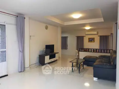 Spacious modern living room with sleek furniture and natural light