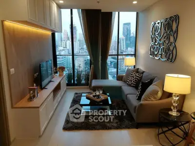 Stylish living room with city view, modern decor, and cozy ambiance in urban apartment.