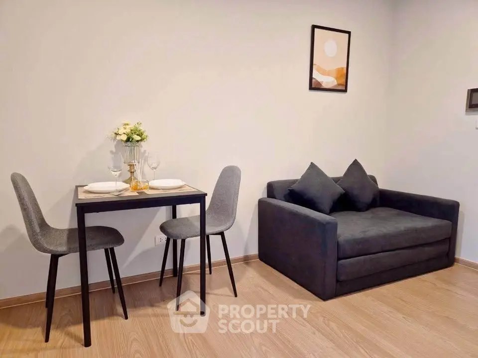 Modern living room with cozy sofa and dining area in stylish apartment.