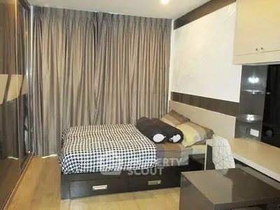 Cozy modern bedroom with stylish decor and ample storage space