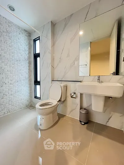 Modern bathroom with sleek design and marble accents