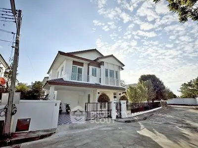 Charming two-story house with modern design and spacious driveway in a serene neighborhood.