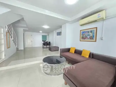 Spacious living room with modern decor and cozy seating area