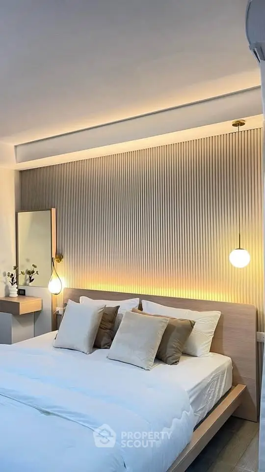 Elegant modern bedroom with stylish lighting and cozy decor