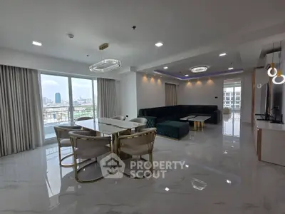 Luxurious open-plan living room with stunning city view and elegant dining area