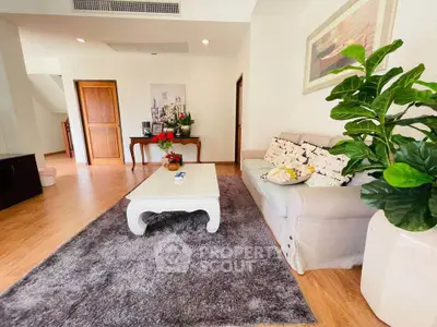 Spacious living room with elegant decor and cozy seating area