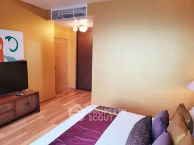 Cozy bedroom with vibrant yellow walls and stylish decor