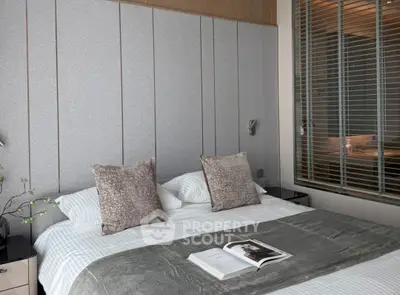 Luxurious modern bedroom with elegant decor and cozy bedding