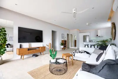 Spacious modern living room with stylish decor and open kitchen layout