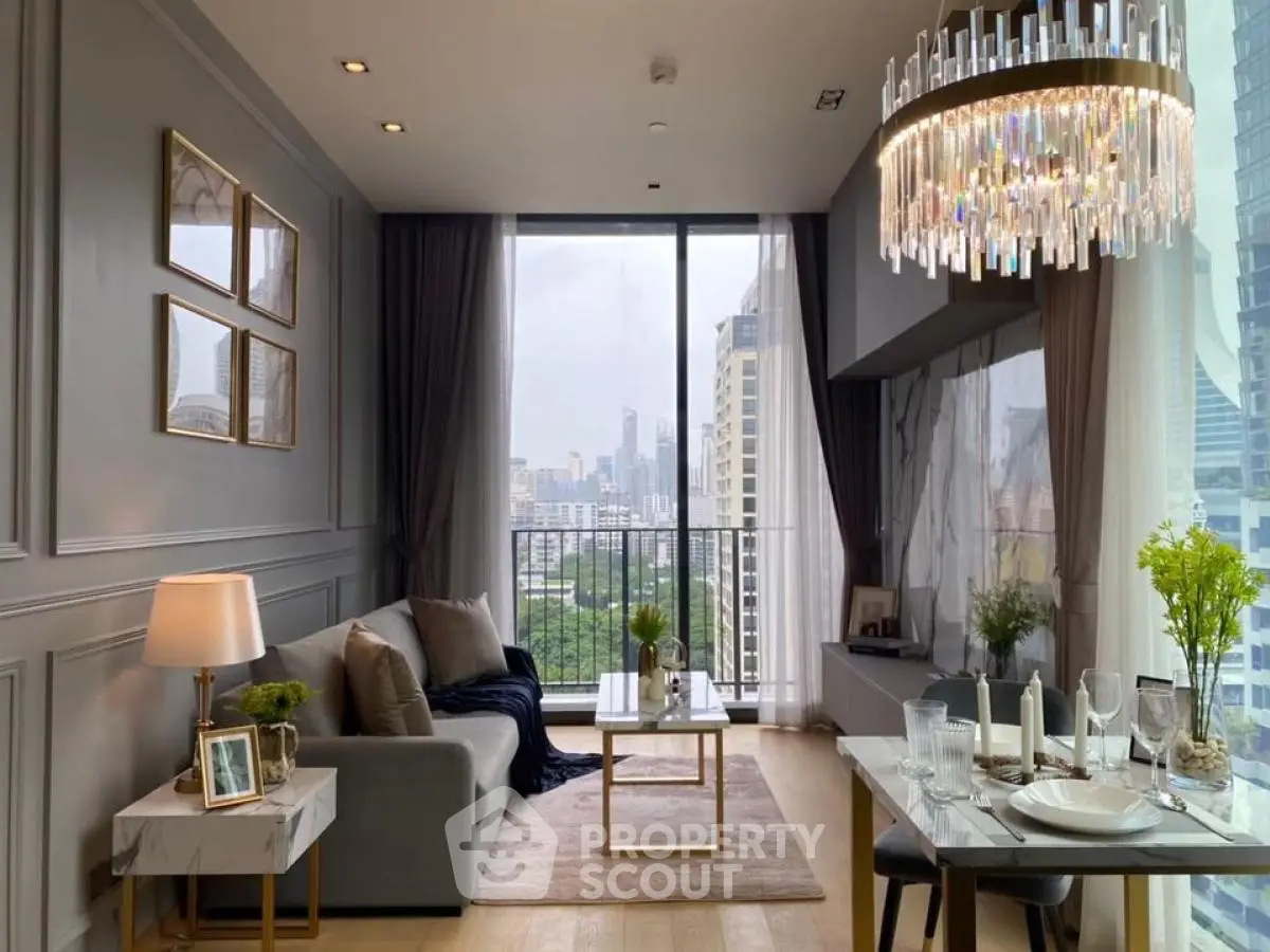 Luxurious living room with city view, elegant chandelier, and modern decor in high-rise apartment.