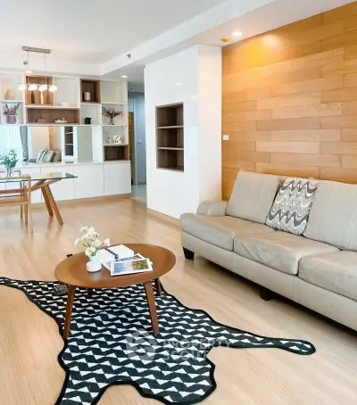 Modern living room with stylish decor and wooden accents