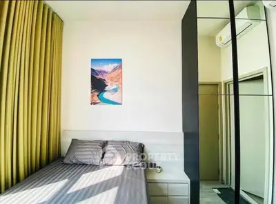 Modern bedroom with stylish decor and natural light