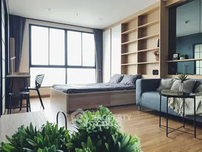 Modern bedroom with large window, cozy bed, and stylish decor