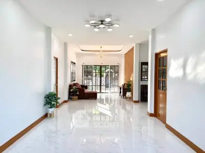 Spacious and bright living room with modern lighting and large windows