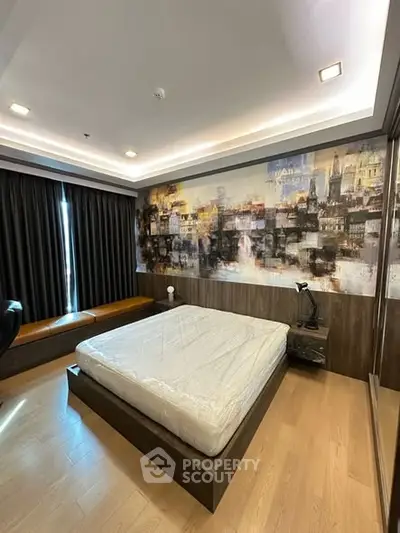 Modern bedroom with artistic wall mural and sleek wooden flooring