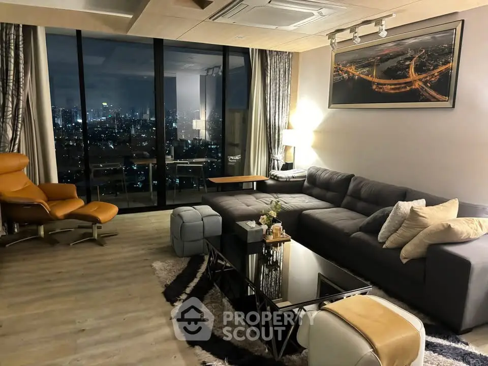 Luxurious living room with city view, modern furniture, and elegant decor.