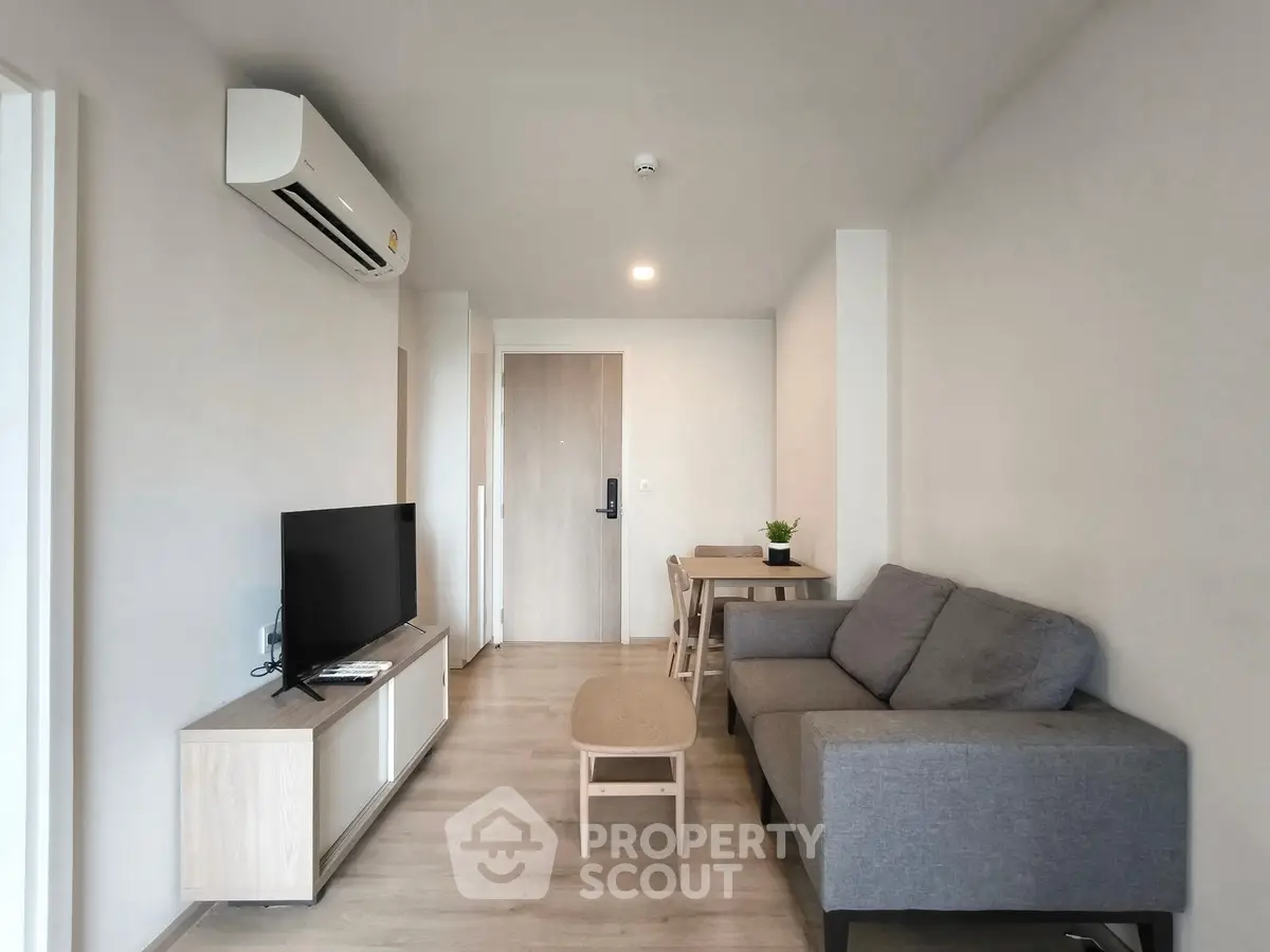 Modern living room with sleek furniture and air conditioning