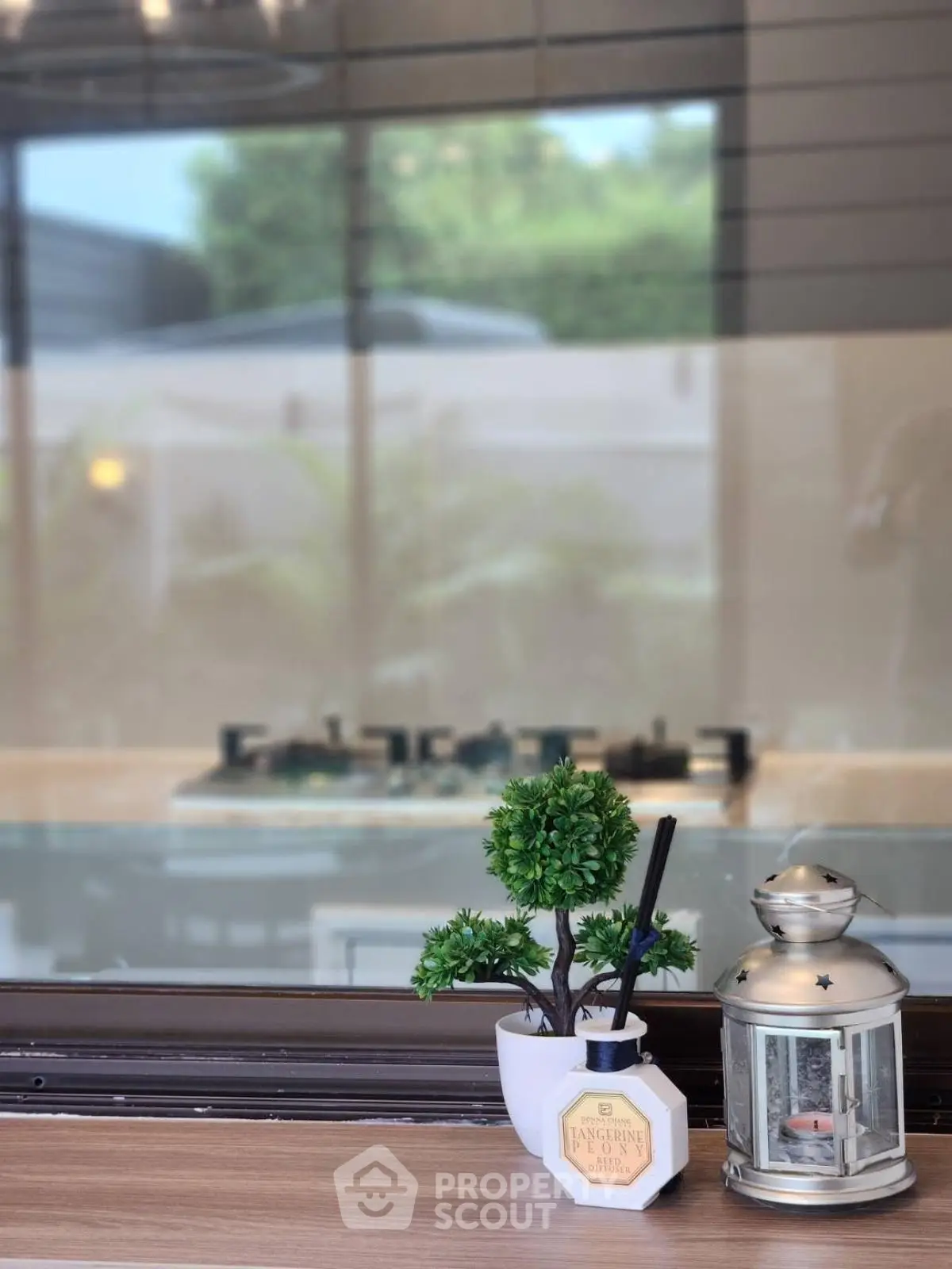 Modern kitchen with sleek gas stove and stylish decor accents