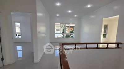 Spacious and bright interior with modern finishes and large windows in a residential property.