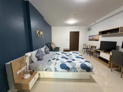 Modern studio apartment with stylish decor and cozy furnishings, perfect for urban living.
