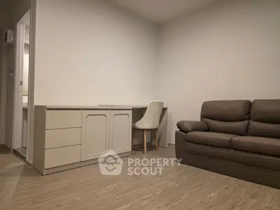 Modern living room with sleek furniture and neutral tones