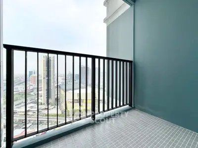Spacious balcony with city view in modern high-rise apartment
