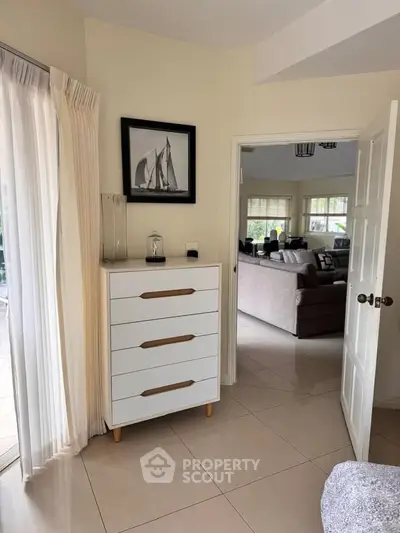 Charming interior view showcasing a cozy living room with elegant decor and natural light.