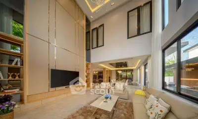 Luxurious modern living room with high ceilings and elegant decor