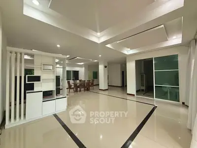 Spacious modern living room with elegant ceiling design and open layout