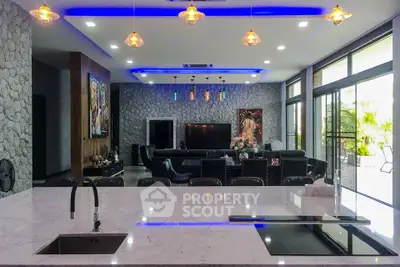 Luxurious open-plan living room with modern kitchen island and stylish lighting
