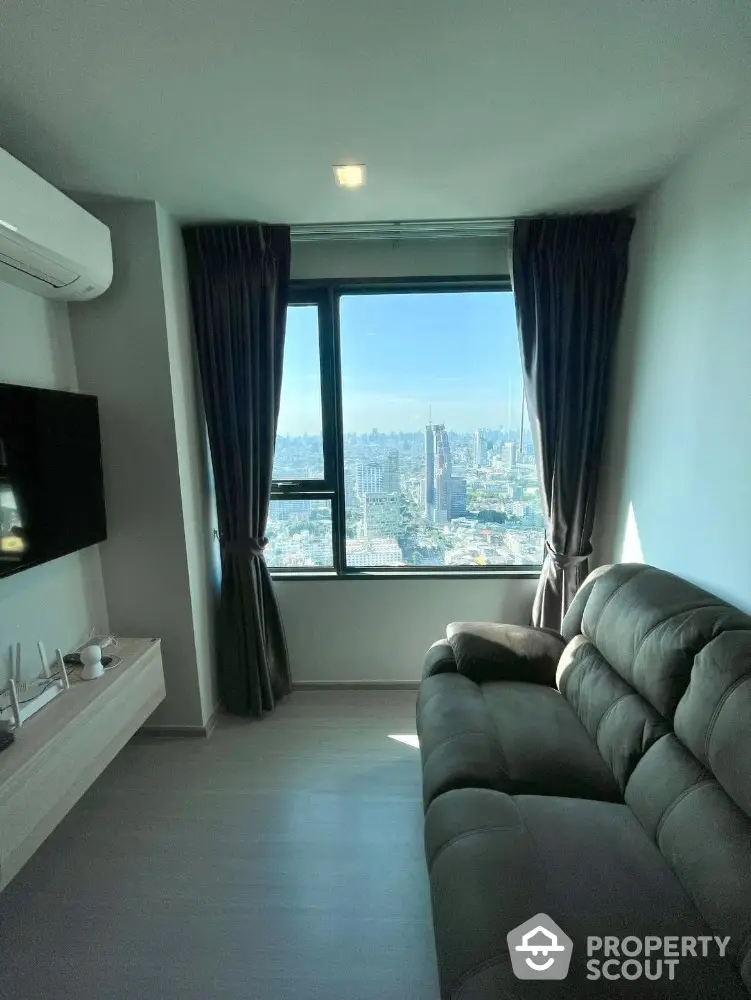 Cozy living room with stunning city view from large window, modern sofa and wall-mounted TV.