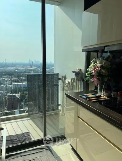Modern kitchen with stunning city view and sleek cabinetry