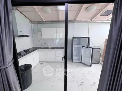 Spacious kitchen with open layout and modern appliances